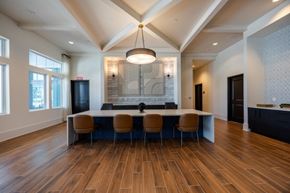 Ruskin apartment for rent - A modern dining room with a long table and chairs.