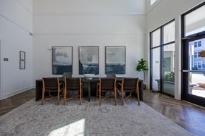 Raleigh apartment for rent - A dining room with a table and chairs and three pictures on the wall.
