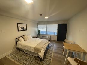 Dalton apartment for rent - A bedroom with a bed, desk, and chair.