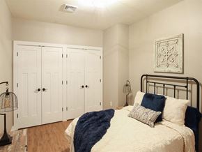 Harrisburg apartment for rent - a bedroom with a bed and a closet