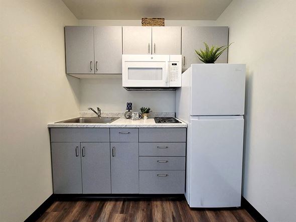 Harrisburg apartment for rent - a kitchen with a sink microwave and refrigerator
