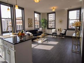 Harrisburg apartment for rent - a living room with a kitchen and a large window