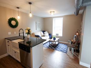 Harrisburg apartment for rent - a living room with a kitchen and a couch