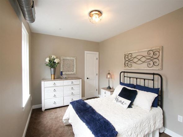 Harrisburg apartment for rent - a bedroom with a bed and a dresser