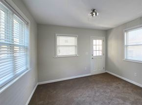 Harrisburg apartment for rent - A room with a carpeted floor and a door.