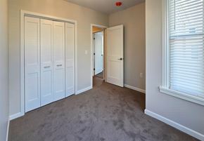 Harrisburg apartment for rent - A room with white doors and a carpeted floor.