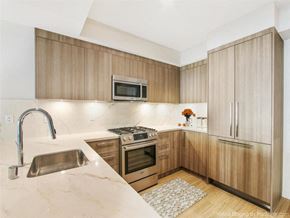 Los Angeles apartment for rent - a kitchen with wooden cabinets and a sink