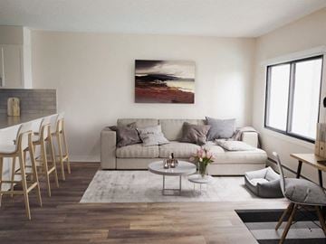 Edmonton apartment for rent - a living room with a couch and a table