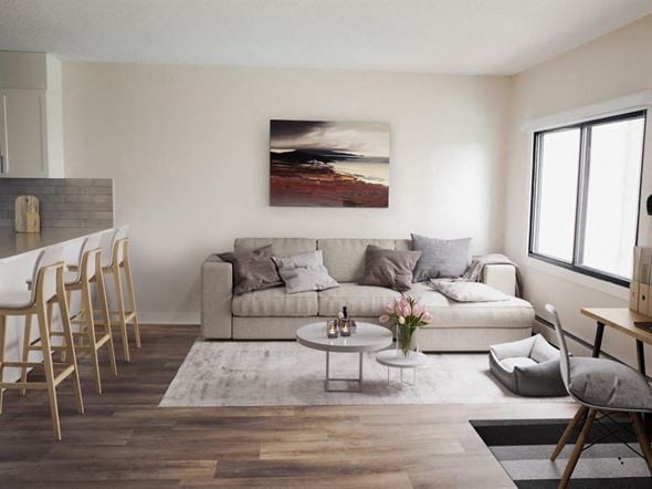 Edmonton apartment for rent - a living room with a couch and a table