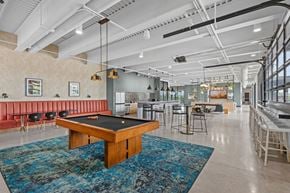 Minneapolis townhouse for rent - A room with a pool table and a bar area.