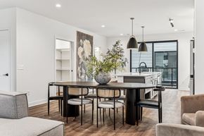 Minneapolis townhouse for rent - A modern dining room with a black table and chairs.