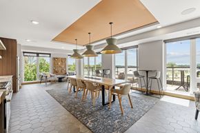 Champlin apartment for rent - A modern dining room with a large table and chairs.