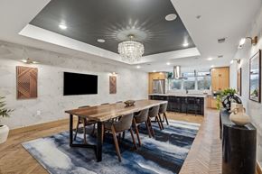 Eden Prairie apartment for rent - A modern dining room with a wooden table and chairs.