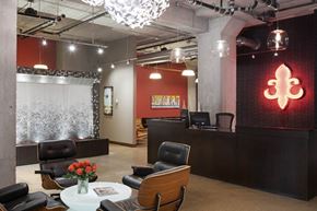 Minneapolis apartment for rent - A modern office space with a reception desk and chairs.