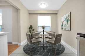 Toronto apartment for rent - A dining room with a table set for six.