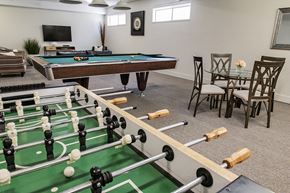 Langley apartment for rent - Glades on 55 games room featuring pool table and foosball table in Langley, BC