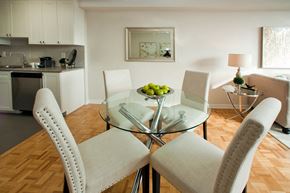Brampton apartment for rent - 190 Cityview in Brampton, ON Open concept dining room with round glass table surrounded by white chairs