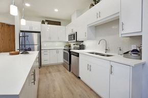 Guelph apartment for rent - Watson Park Apartments kitchen featuring stainless steel appliances and white cabinets in Guelph, ON