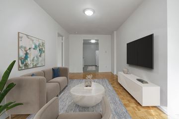 Toronto apartment for rent - A living room with a white couch and a painting on the wall.