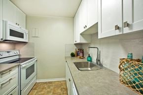 St. Thomas apartment for rent - Wellington Park Towers kitchen with full range stove and microwave in St. Thomas, ON
