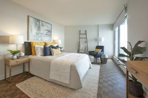 Burlington apartment for rent - La Salle Towers primary bedroom featuring large windows in Burlington, ON