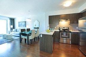 Brampton apartment for rent - Cityview Apartments Neutral coloured kitchen and dining room with a teal table cloth in Brampton, ON
