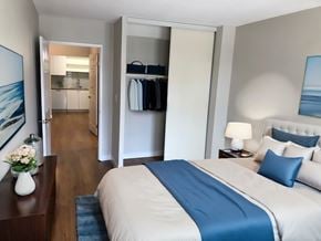 Toronto apartment for rent - A bedroom with a large bed and a view of the ocean through a window  at Angus House in Toronto  at Angus House in Toronto