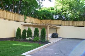 Bradford apartment for rent - Backyard with BBQ and tables and chairs at Bradford Place Apartments in Bradford, ON
