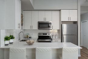 Kelowna apartment for rent - Glenmore Central in Kelowna, BC kitchen breakfast bar with quartz counter tops