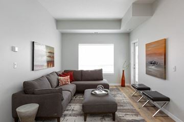 Kelowna apartment for rent - A living room with a grey couch and a coffee table.