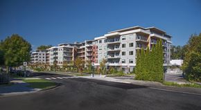 Port Moody apartment for rent - a view of an apartment building on a city street