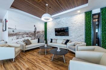 Lounge/social room with fireplace, kitchen and private dining room