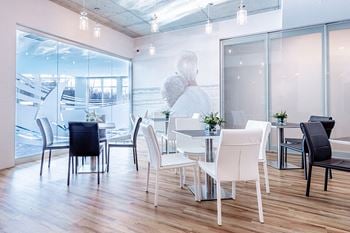 Lounge/social room with fireplace, kitchen and private dining room