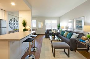 Niagara Falls apartment for rent - Laura Secord Apartments spacious living room with view into kitchen in Niagara Falls, ON