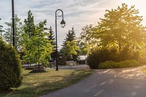 Brossard apartment for rent - Evening view of walking trail steps from Le Saint-Laurent Apartments in Brossard