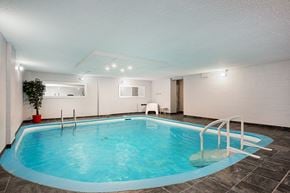 Sherbrooke apartment for rent - a swimming pool with a ladder in the middle of it