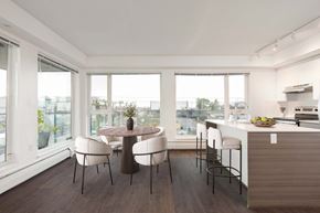 Vancouver apartment for rent - A modern kitchen with a dining table and chairs at 388 Kaslo East Village.