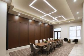 Cote Saint-Luc apartment for rent - A conference room with a long table and chairs.