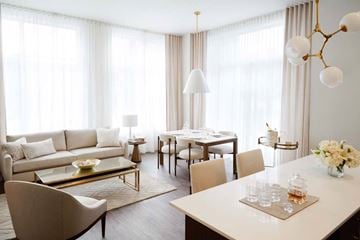 Cote Saint-Luc apartment for rent - A modern living room with a dining table and chairs.