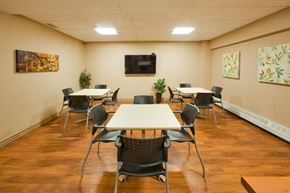Hamilton apartment for rent - Market Street Apartments Social room with table and seating in Hamilton, ON