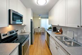Owen Sound apartment for rent - Marlan Towers in Owen Sound, ON modern kitchen with white cabinetry and stainless steel appliances