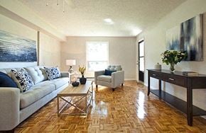 Whitby apartment for rent - A living room with a couch, coffee table, and a painting on the wall.