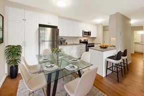 Kingston apartment for rent - A modern kitchen with a glass dining table and chairs.