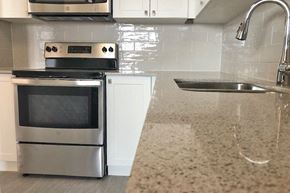 Toronto apartment for rent - San Remo/Monaco in Toronto, ON upgraded kitchen with modern cabinetry and countertop finishes