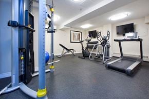 Georgetown apartment for rent - Silvercreek Towers in Georgetown, ON fitness room with cardio and weight machines
