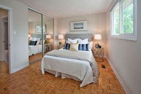 Oshawa apartment for rent - Taunton Terrace large bedroom with hard surface flooring and mirrored closet