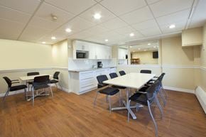Cobourg apartment for rent - Trillium Apartments social room with kitchenette and tables and chairs in Cobourg, ON