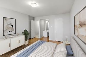 North York apartment for rent - Primary bedroom with closet,  dressing area and hardwood flooring Village Tower Toronto ON