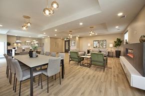 Guelph apartment for rent - Watson Park Apartments social room featuring fireplace, lounge seating and large dining area in Guelph, ON