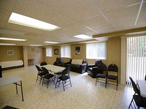 Amherstburg apartment for rent - Dalhousie Place large social room with tables and chairs